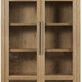 Front view of cabinet emphasizing metal bar handles and seeded glass door texture