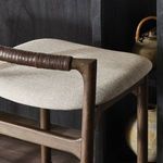 Detail view of Baden Bar Stool in modern kitchen setting with pottery decor