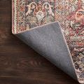 Layla Spice Marine Rug folded corner exposing solid gray underside backing on dark wood floor