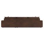 Back view of the sectional revealing clean back panels and uniform leather texture