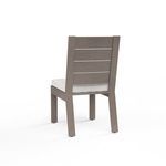 Rear view of Laguna armless chair showing slatted back and cushion