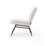 Side profile of Caleb Small Ivory Angora Accent Chair against white background displaying suspension under seat