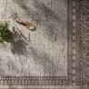 Easton Dove side rug top view with gardening trowel and potted plant casting shadows