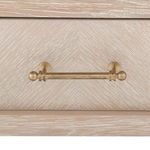 Close-up of bronze drawer pull featuring rounded ends and aged finish