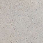 Full-frame close-up of speckled gray concrete surface with small brown and blue flecks