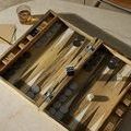 Metal hinge close-up embedded flush in light spalted wood backgammon box