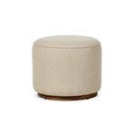 Sinclair Outdoor Ottoman with rounded shape, light beige woven fabric, and wooden swivel base