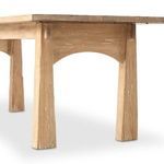 Straight side view focusing on leg taper and aged wood texture under the tabletop