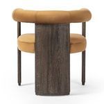 Back view emphasizing broad, solid oak panel supporting the curved upholstered backrest