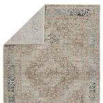 Back side of traditional medallion rug revealing muted pattern and woven construction