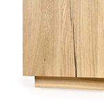 Detailed view of base edge showing subtle shadow and smooth grain pattern on oak veneer