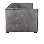 Side view of Eli sofa highlighting tufted side panel and wide armrest