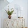 Alandra Console Table styled with lamp and vase in a bright minimalist room setting