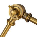 Detailed view of brass pivot joint and fastening screw on adjustable arm