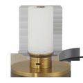 Close-up of lamp bulb sitting on charging plate with small red charge indicator light on brass base