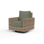 Outdoor swivel rocker chair with premium all-weather wicker in rich aged tobacco and sage green cushions