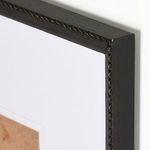 close-up of black distressed Brimfield frame texture with ridged and carved detailing