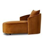 Three-quarter profile highlighting chaise lounge’s sculpted sides and plush pillow
