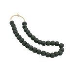 Oval arrangement of beads with visible natural fibers and variations in bead size and shape