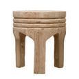 Solano Carved Stool with darker wood tones and visible grain from front angle