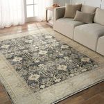 Pia Medallion rug styled in a sunny living room next to a light gray sofa and wooden side table