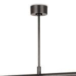 Close-up of the black metal ceiling mount and suspension rod of the chandelier