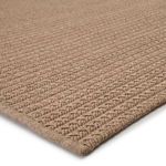 Angled close-up showing flat woven pattern with visible rows and edge binding in light tan