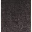 Black modern rug with geometric triangle pattern and a textured, plush pile with high and low areas