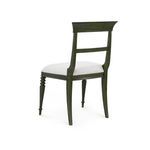 Rear angled view of Lawrence Side Chair highlighting curved backrest and oak grain texture.