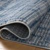 Close-up of Townes Grey / Denim Rug edge with folded corner showing woven texture and pile detail