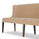 Close-up showing gentle curve of side armrest upholstered in luxe taupe velvet