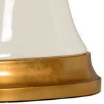 Close-up of antique gold leaf finish on base showing textured metallic effect