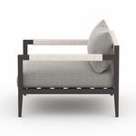Side view with focus on detailed rope wrapping on armrests and straight legs of the Sherwood outdoor chair