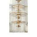 Slightly angled front view showing the depth and layering of the three tiers of glass bars and brass rings