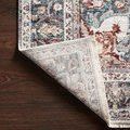 Samra Ivory / Denim Rug corner lifted showing woven polypropylene backing and short fringed edge