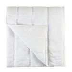 cloud white quilt with large channel stitching, handcrafted with soft ramie fabric, folded to show reverse side
