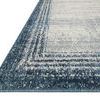Close-up angled edge view showing thick pile and blue tone border detail