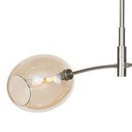 Close-up of smaller champagne glass globe attached to polished nickel arm with visible bulb