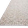 Low angle side view highlighting flat weave and edge detail of Townes Beige Clay Rug