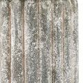 Close-up of the weathered concrete base showing detailed stippling and vertical ridges