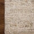 Close-up of rug edge on wooden floor showing fine woven border and soft tones