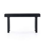 End view of Tilda desk with arched cane panel leg visible beneath thick rectangular top