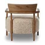 Rear view of Bennett Chair showcasing curved oak backrest and shearling cushion wrapping