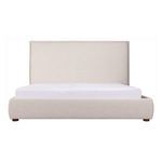 Front view of bed with mattress slightly tucked in under upholstered frame