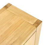 Close-up of top corner showing seamless oak surface and wood joinery details