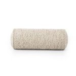 Bolster pillow viewed from end-on showing full circular profile and texture