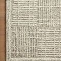 Close-up of Tallulah Mist Ivory Rug corner showing thick and fine yarns in textured linear pattern