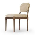 Three-quarter low-angle side view emphasizing cushion thickness and tapered oak legs