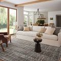 Ember Espresso rug styled in bright living room under sofa and coffee table with beige and gray pillows