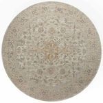 Round version of the Rosemarie Ivory/Natural Rug displaying medallion center and floral border pattern